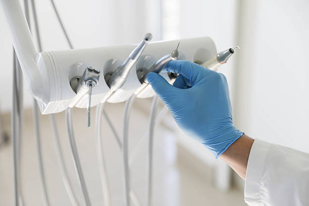 Professional Tooth Extraction technician working in North Kansas City, MO